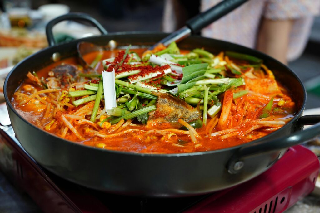 Hot pot of traditional Korean fish stew with fresh vegetables in Seoul, South Korea.